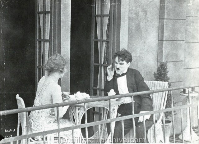 Edna Purviance and Charlie Chaplin in THE ADVENTURER (1917)