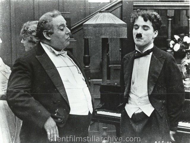 Henry Bergman and Charlie Chaplin in THE ADVENTURER (1917)