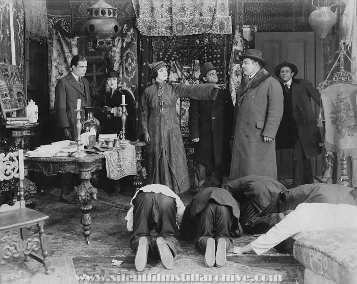 Earle Foxe, Pearl White, Ruby Hoffman, Caesare Gravinia, and Warner Oland in THE FATAL RING (1917).