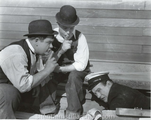 Oliver Hardy, Stan Laurel, and Edgar Kennedy in THE FINISHING TOUCH (1928)