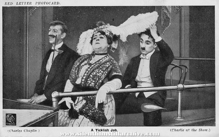Red Letter Photocard of Carrie Clark Ward and Charlie Chaplin in A NIGHT IN THE SHOW (1915)