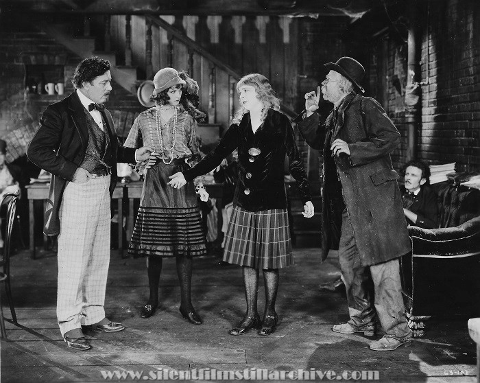 Twinkletoes, A First National Production -- Twinkletoes asks Roseleaf where her father is while Lilac looks on and Hank signals Roseleaf not to tell. Warner Oland, Julanne Johnston, Colleen Moore, and Lucien Littlefield