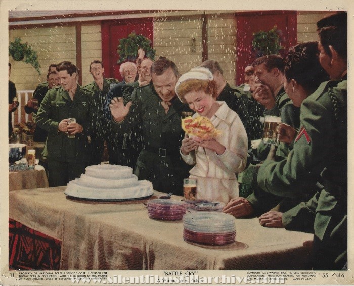 Aldo Ray and Nancy Olson at the table with their wedding cake in BATTLE CRY (1955)
