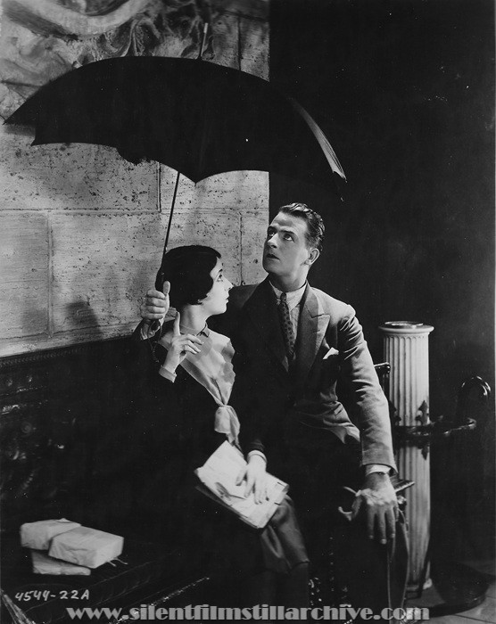 Gertrude Olmstead and Reginald Denny in THE CHEERFUL FRAUD (1926)