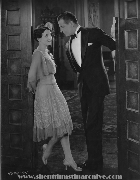 Gertrude Olmstead and Reginald Denny in THE CHEERFUL FRAUD (1926)