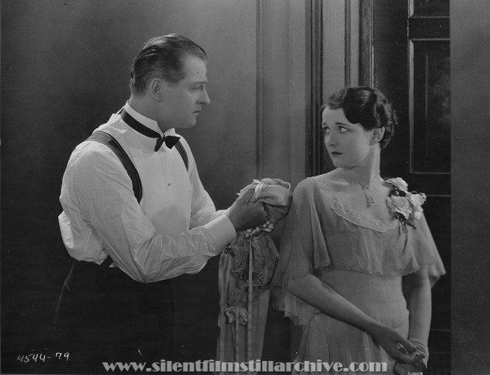 Reginald Denny and Gertrude Olmstead in THE CHEERFUL FRAUD (1926)