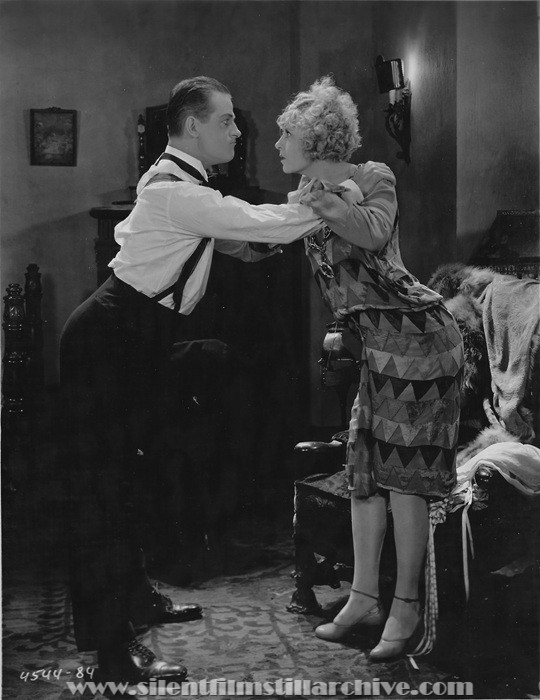 Reginald Denny and Gertrude Olmstead in THE CHEERFUL FRAUD (1926)
