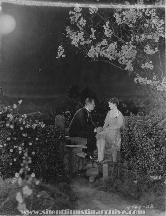 Reginald Denny and Gertrude Olmstead in THE CHEERFUL FRAUD (1926)