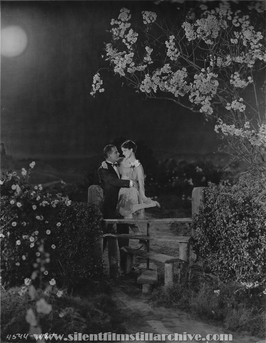 Reginald Denny and Gertrude Olmstead in THE CHEERFUL FRAUD (1926)