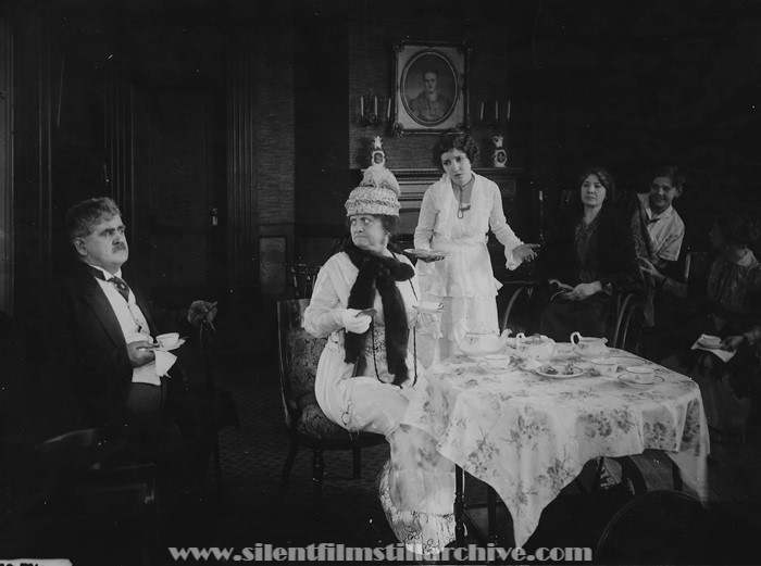 Aggie Herring, Bessie Love, and Gordon Griffith in CUPID FORCLOSES (1919).