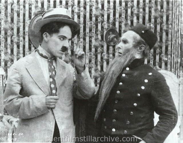 Charlie Chaplin and James T. Kelly in THE CURE (1917).