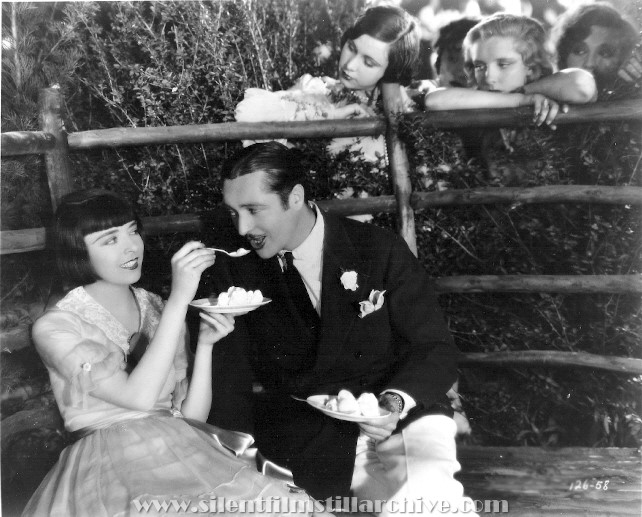 Colleen Moore and Edmund Lowe in HAPPINESS AHEAD (1928)