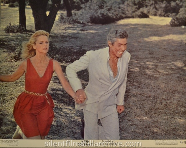 Lobby card with Lee Remick and James Coburn in HARD CONTRACT (1969)