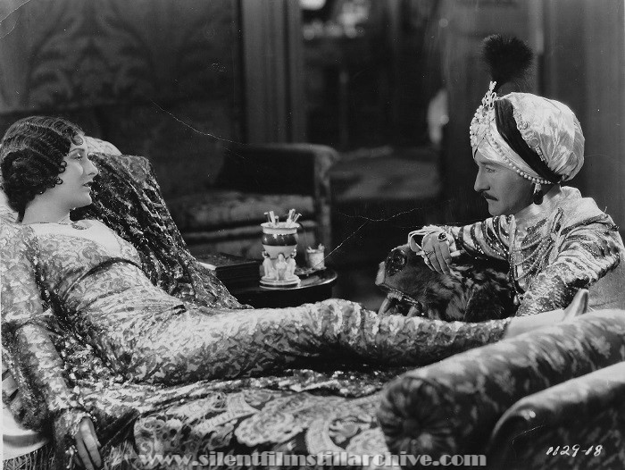 Evelyn Brent and Adolphe Menjou in HIS TIGER LADY (1928)