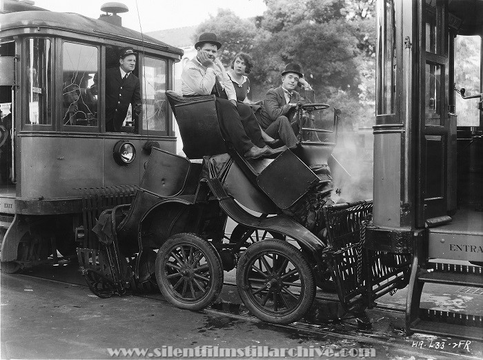 Oliver Hardy, Yola d'Avril, and Stan Laurel in PELE-MELE (1930), the French version of HOG WILD (1930)