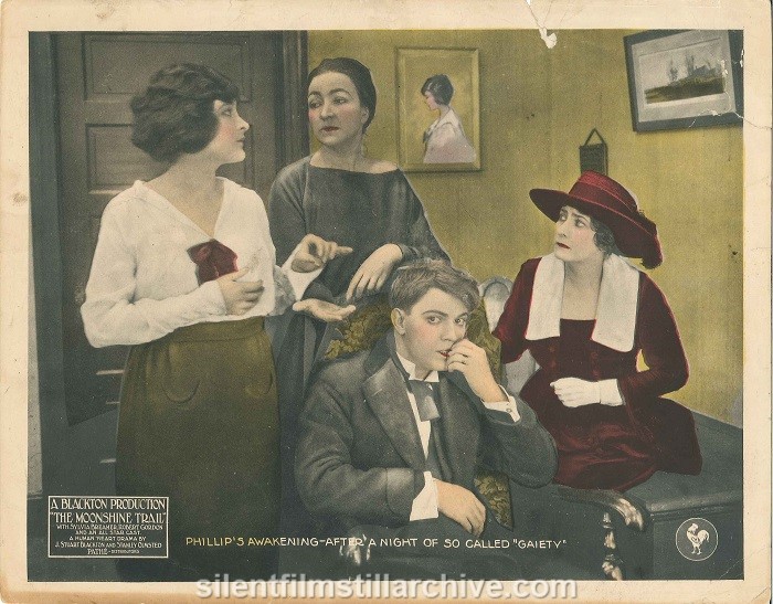 Lobby card for THE MOONSHINE TRAIL (1919) with Sylvia Breamer, Robert Gordon and Julia Swayne Gordon.