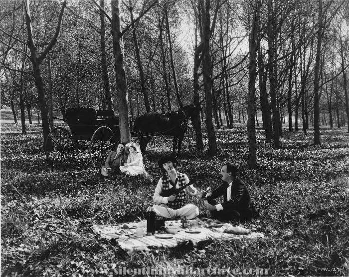 Edmund Lowe, Claire Windsor, Raymond Griffith and Mae Busch in NELLIE THE BEAUTIFUL CLOAK MODEL (1924)