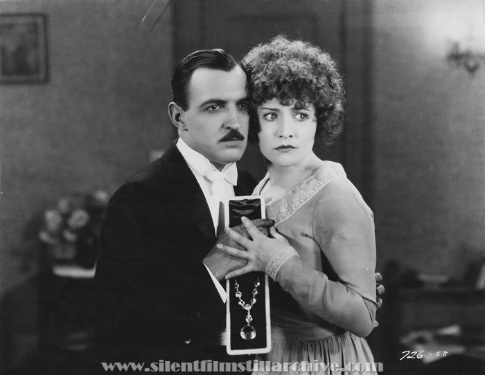 Raymond Griffith and Betty Compson in PATHS TO PARADISE (1926)
