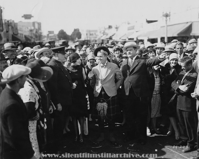 Chester A. Bachman, Dorothy Coburn, Stan Laurel and Oliver Hardy in PUTTING PANTS ON PHILIP (1927)