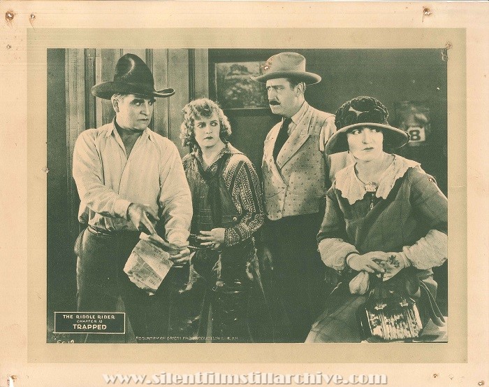 William Desmond, Ileen Sedgwick, William Gould, and Helen Holmes in THE RIDDLE RIDER (1924)