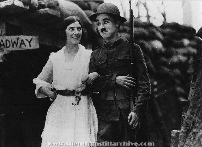 Lucille Cavanaugh and Charlie Chaplin on the set of SHOULDER ARMS (1918)