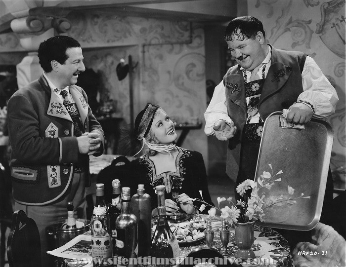 Ludovico Tomarchio, Della Lind (Grete Natzler), and Oliver Hardy in SWISS MISS (1938)