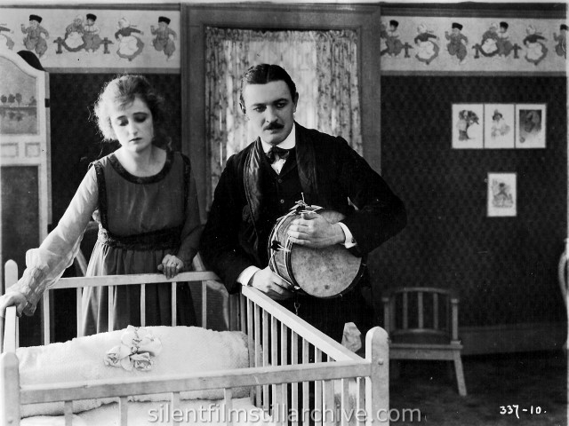 Rae Godfrey and Raymond Griffith in THEIR NEIGHBOR'S BABY (1918)