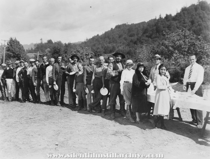 Mealtime on location while shooting TOL'ABLE DAVID (1930) with Joan Peers, Helen Ware, Noah Beery, Richard Cromwell, director John Blystone, and John Carradine