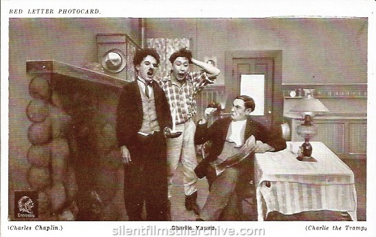 Red Letter Photocard of Charlie Chaplin, Ernest VanPelt and Paddy McGuire in THE TRAMP (1915)