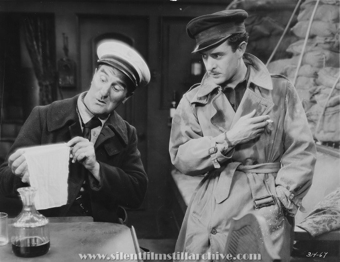 Ernest Torrence and John Gilbert in TWELVE MILES OUT (1927)