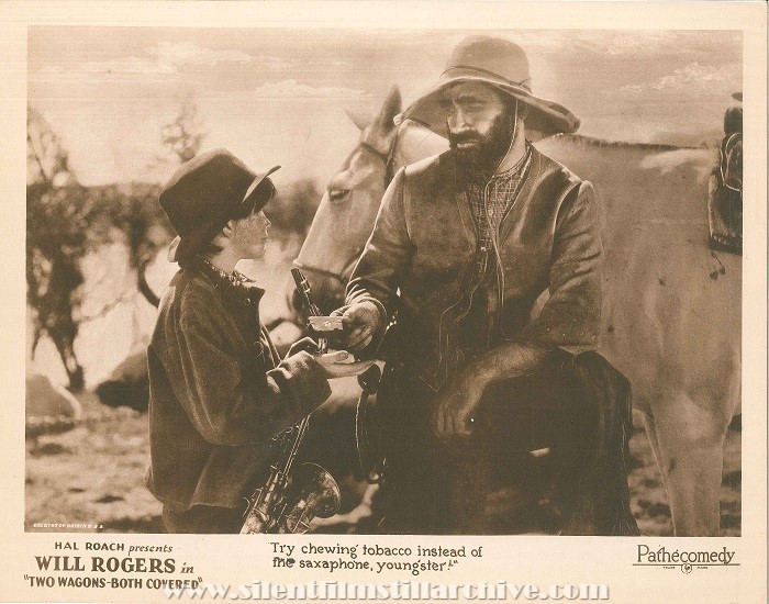 Lobby card for TWO WAGONS - BOTH COVERED (1924) with Elmo Billings and Charles Lloyd